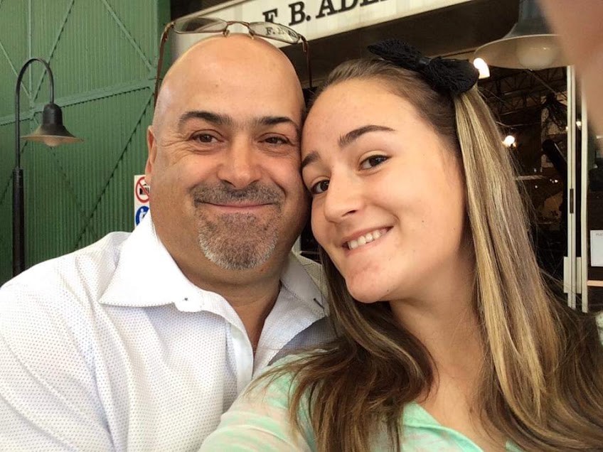 Dad and his daughter smiling cheek to cheek