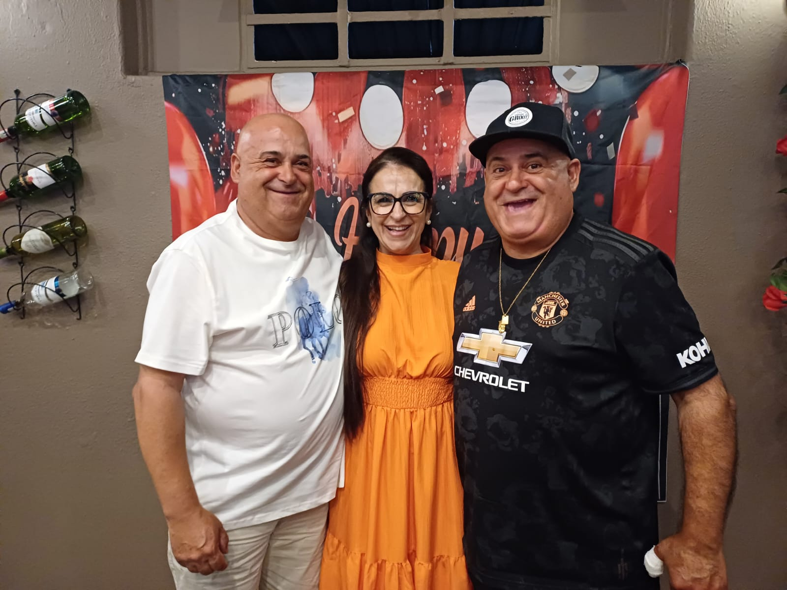 Dad celebrating with two friends at a party